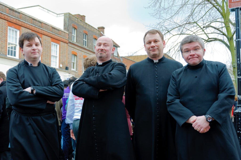 vicars taking part in pancake race
