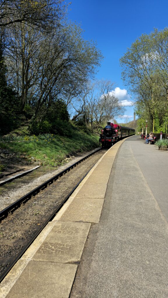 Steam Train Arrives at Haworth Railway Station - Andy Cole-Kinsey