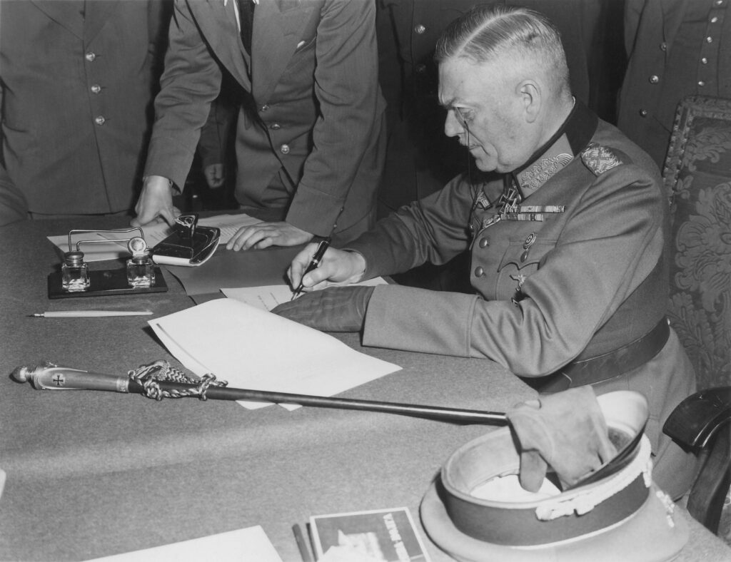 Field Marshal Wilhelm Keitel signing the unconditional surrender of the German Wehrmacht at the Soviet headquarters in Karlshorst, Berlin.